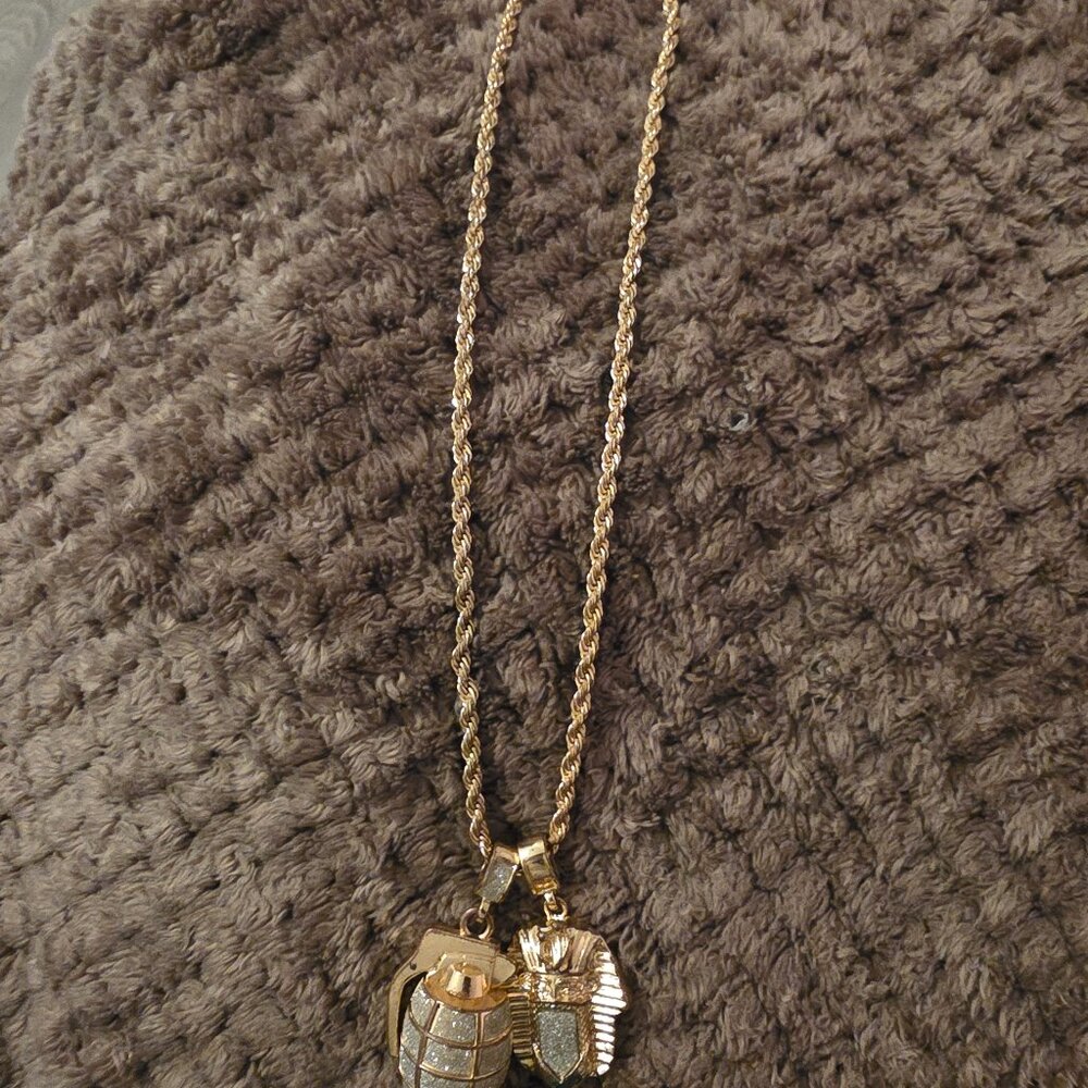 Gold necklace and charms